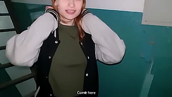 Young redhead receives a surprising oral surprise in a stairwell