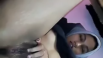 Young Hijab-Wearing Indonesian Woman Pleasures Herself To Climax